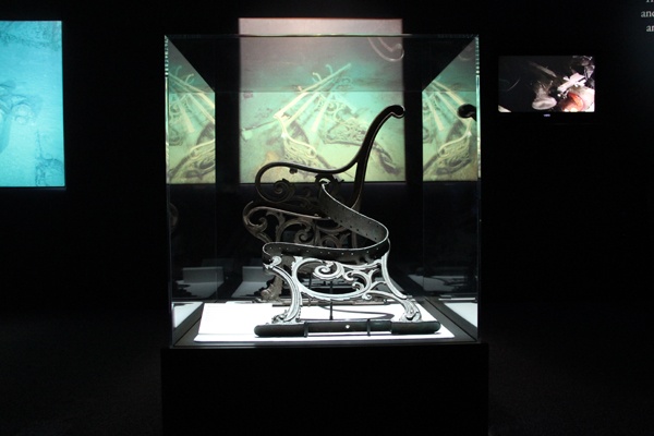 Some of the objects in the Titanic exhibition at the Franklin Institute, like this deck bench, are displayed as they were found on the ocean floor. (Emma Lee/for NewsWorks)