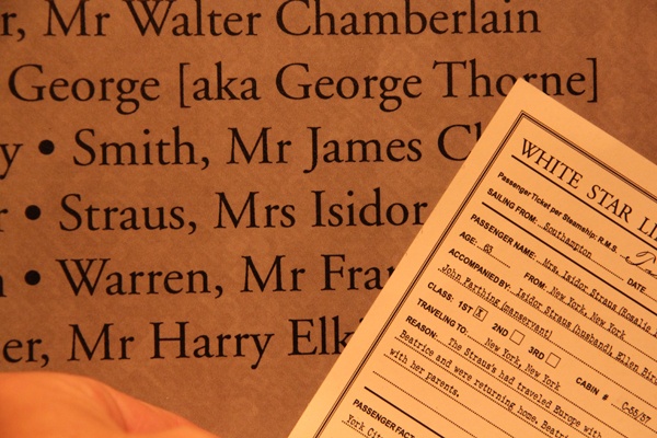 A visitor's boarding pass matches the list of casualties that concludes the Titanic exhibit. A disproportionate number of first class passengers survived the sinking, but Mrs. Isidor Straus and her husband did not. (Emma Lee/for NewsWorks)