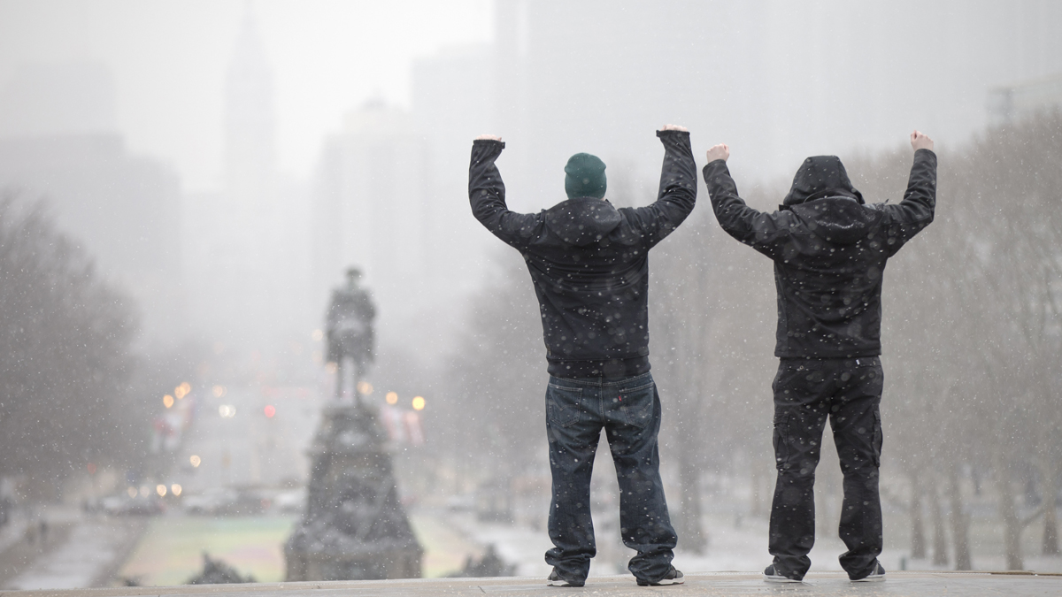  During a winter storm tourists imitate the character Rocky Balboa on the steps of the Philadelphia Museum of Art in Philadelphia, Pa. Philadelphia will host the Democratic National Convention in 2016. (AP Photo/Matt Rourke) 