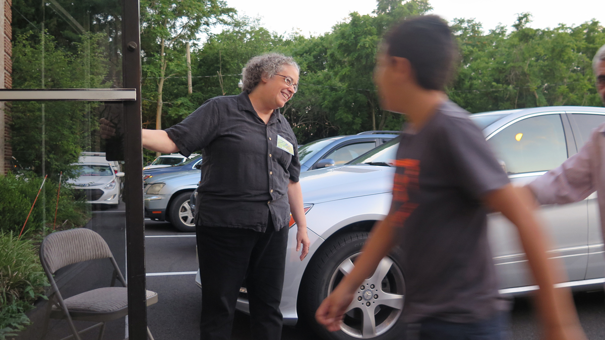  Ann Wenger greets worshippers at the Islamic Center of Lancaster during Ramadan. (Emily Previti/WITF)  