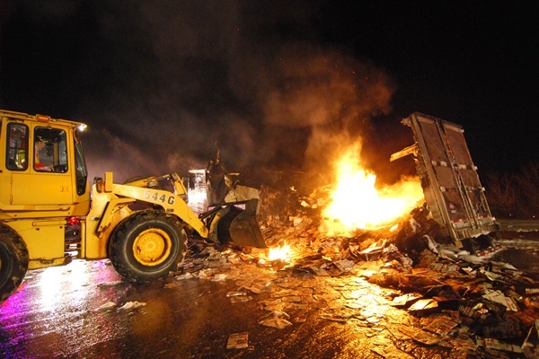 <p><p>A front end loader assists the fire fighting effort on I-495. (John Jankowski/for NewsWorks)</p></p>
