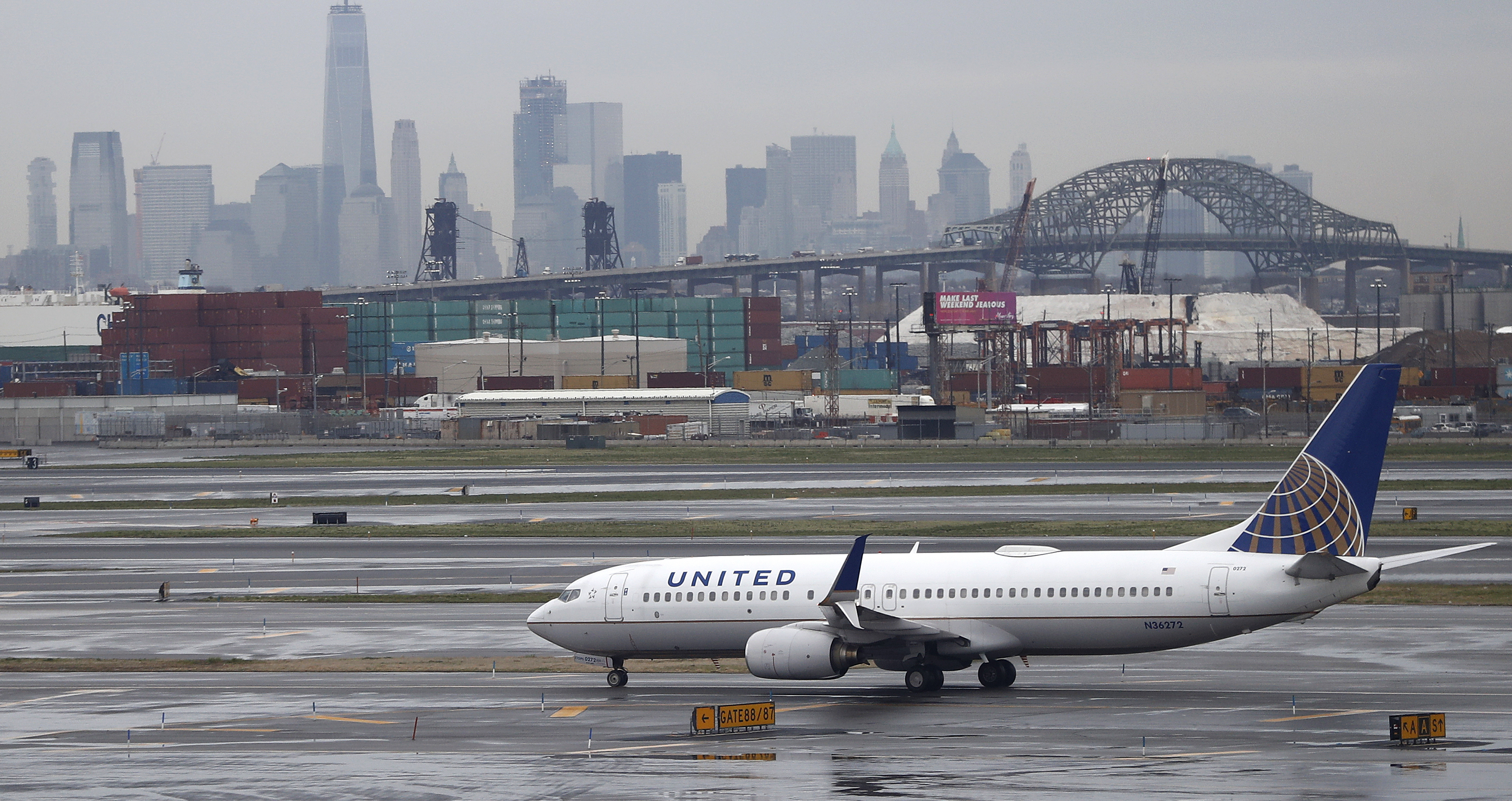 The New York City skyline gives backdrop to a United Airlines airplane taxing at Newark Liberty International Airport, Wednesday, April 12, 2017, in Newark, N.J. (AP Photo/Julio Cortez, file) 