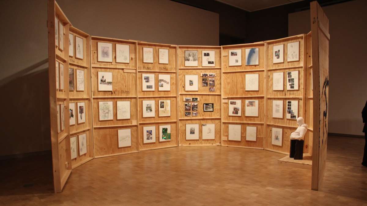 Artwork inspired by ''Horse Day'' is displayed in an enclosure built by riding club members.