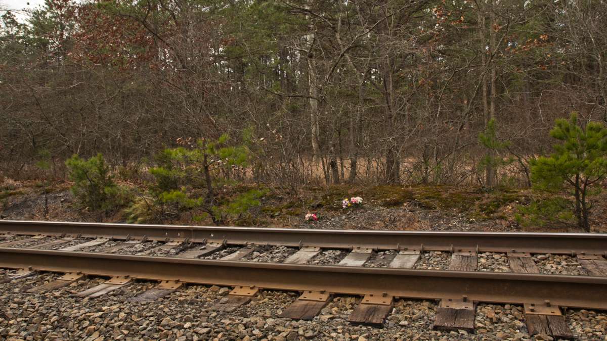 Flowers mark the spot where Tiffany Valiante was struck by the train in July of 2015.