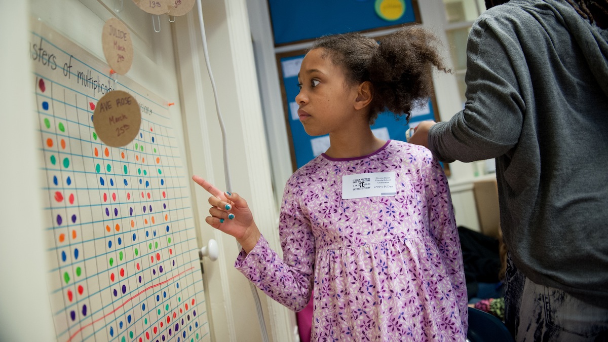 Naomi Davis, 9, looks for circles to measure in her third grade classroom. Friday was 