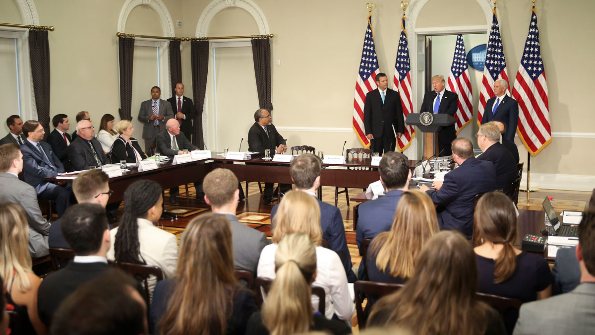  President Donald Trump, with Kansas Secretary of State Kris Kobach and Vice President Mike Pence, right, speaks at a meeting of the Presidential Advisory Commission on Election Integrity, Wednesday, July 19, 2017. (AP Photo/Pablo Martinez Monsivais) 