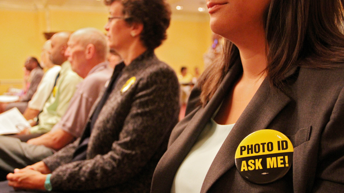  Volunteers listen as members of the Pennsylvania Voting Rights Coalition announce a campaingn to thwart the state's controversial voter ID law. (Emma Lee/for NewsWorks) 