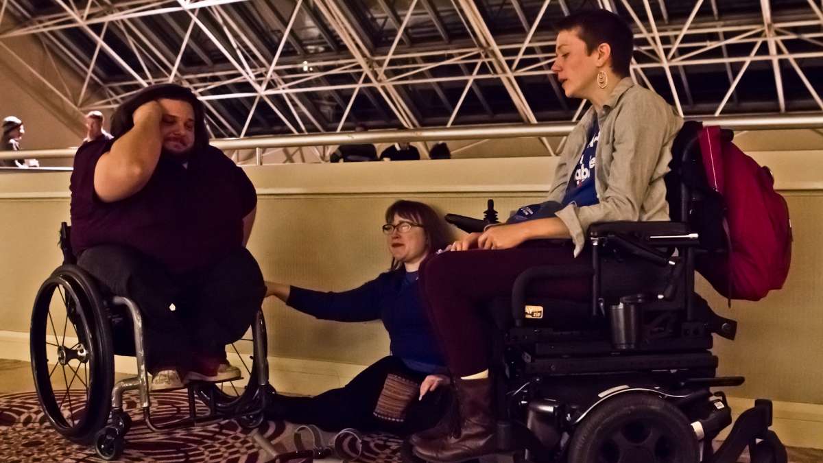 Disability rights advocates (from left) Matthew Clark, Laura Cohen, and Dynah Haubert left the Pennsylvania Democrats watch party as Donald Trump began to claim most of the states in the race.