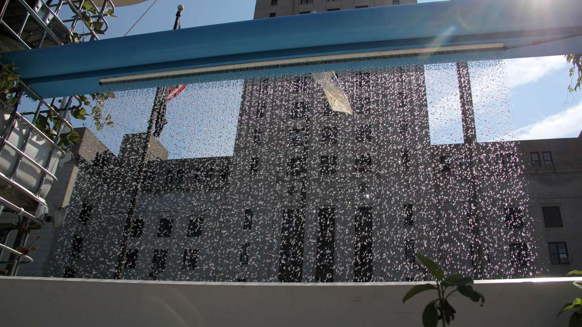 A rain curtain fountain falls in front of Camden City Hall. (Emma Lee/WHYY)