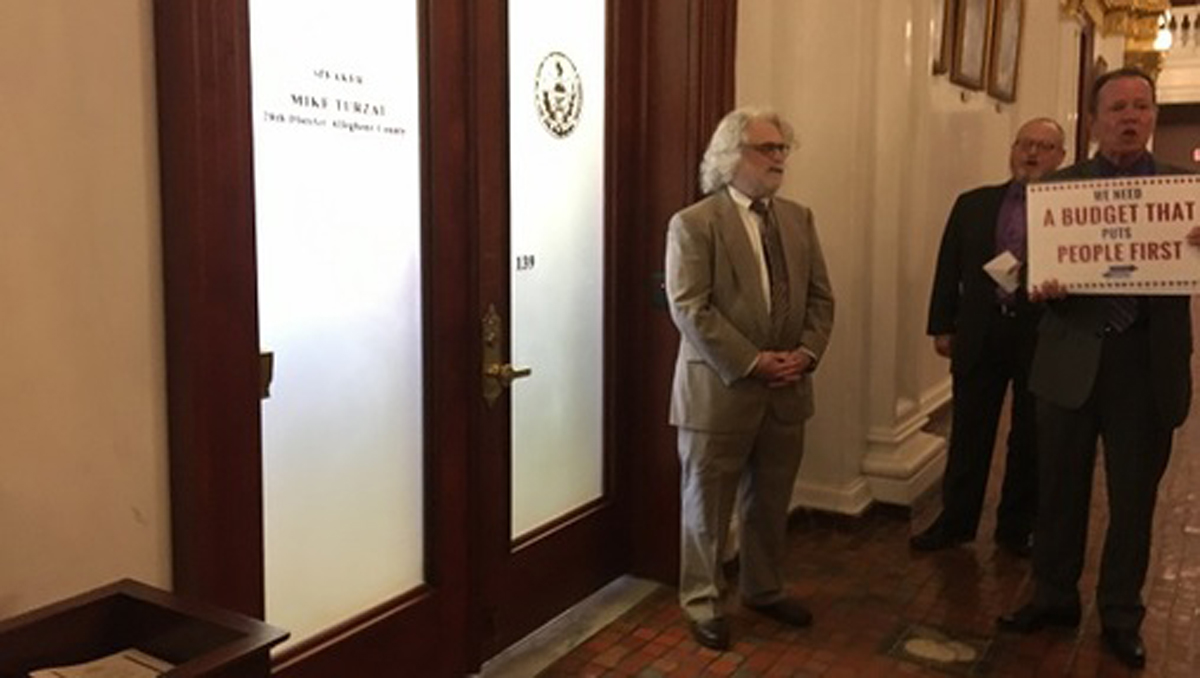  Protesters chant outside Pennsylvania House Speaker Mike Turzai's office door. (Katie Meyer/WITF) 