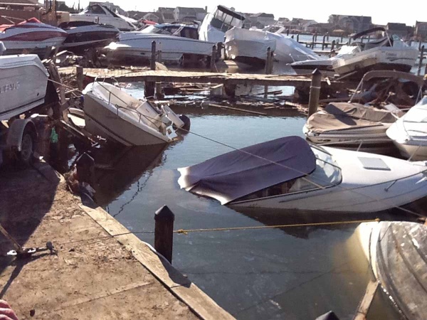 <p><p>After the storm the marina was littered with damaged boats resting on top of debris from oceanfront homes that washed across the island. (Photo courtesy of Jimmy Ryan)</p></p>
