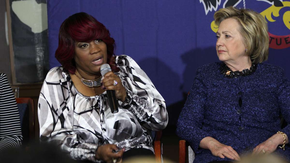 During a campaign stop in Philadelphia, Democraticc presidential candidate Hillary Clinton listens as Tanya Brown-Dickerson talks about the fatal shooting of her son, Brandon Tate-Brown, by a Philadelphia police officer. (Emma Lee/WHYY)