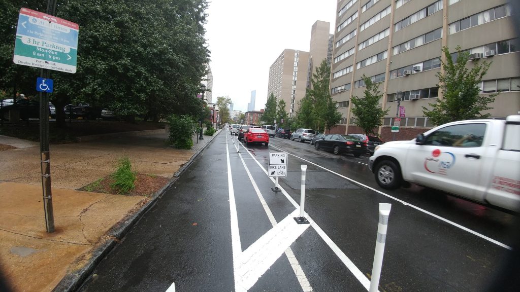 20170829_112549 New 'buffered' bike lanes unveiled on Chestnut Street in West Philadelphia. Bike lane is to the left, on-street parking is next and after that are regular travel lanes (Tom MacDonald/WHYY).