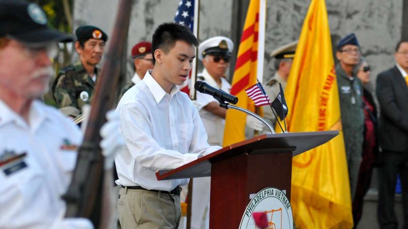 A brief bio of each of the missing men is read and POW/MIA flags are placed near their names.