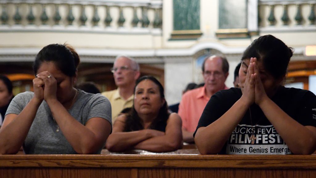 About 250 people gathered at St. Patrick's Church in Norristown, Pa. to pray for victims of this week's earthquake in Mexico and Hurricane Maria in Puerto Rico. (Bas Slabbers/for NewsWorks)