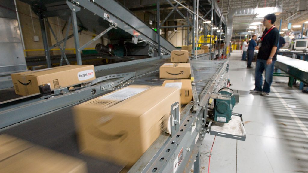 amazone-wants-to-build Packages from Amazon ahead of delivery (Scott Sady/AP Photo)