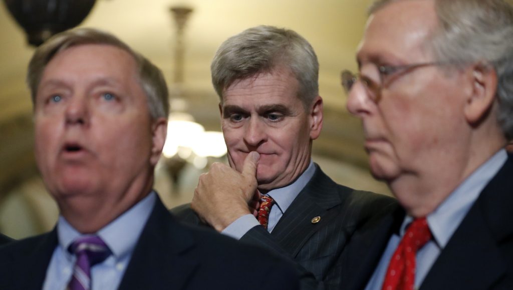 ap_17262758587232 Sen. Bill Cassidy, R-La., center, listens as Sen. Lindsey Graham, R-S.C., left, speaks, accompanied by Senate Majority Leader Mitch McConnell of Ky., on Capitol Hill, Tuesday, Sept. 19, 2017 in Washington. (AP Photo/Alex Brandon)