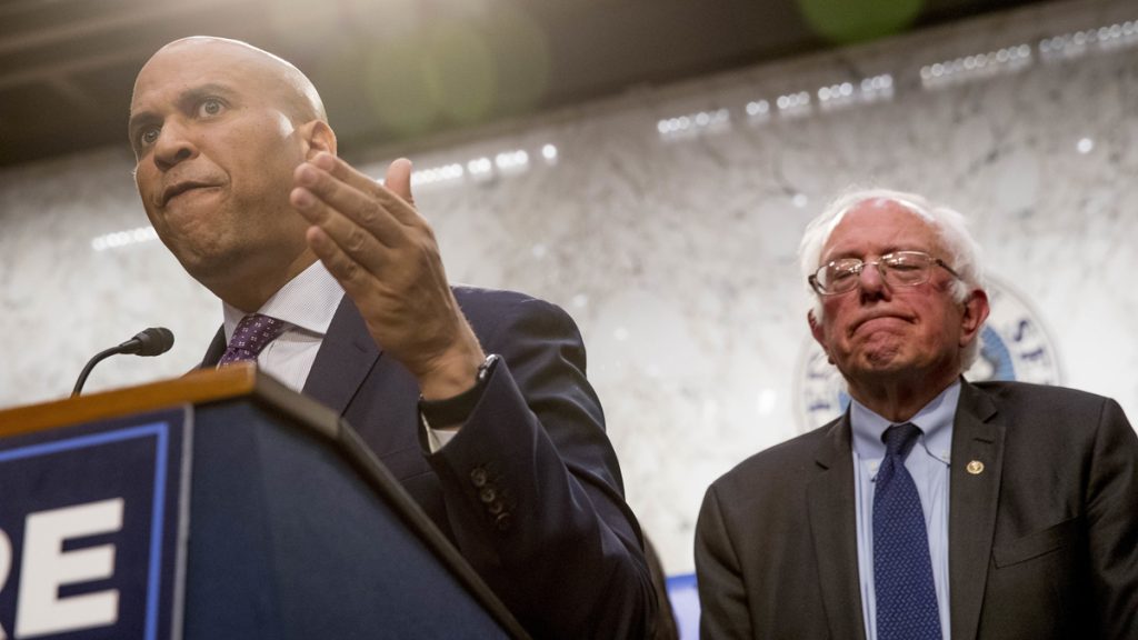 apbookerberniemedicaid4allx1200 Sen. Cory Booker, D-N.J., (left), accompanied by Sen. Bernie Sanders, I-Vt., (right), speaks during a news conference on Capitol Hill in Washington, Wednesday, Sept. 13, 2017, to unveil their Medicare for All legislation to reform health care. (Andrew Harnik/AP Photo)