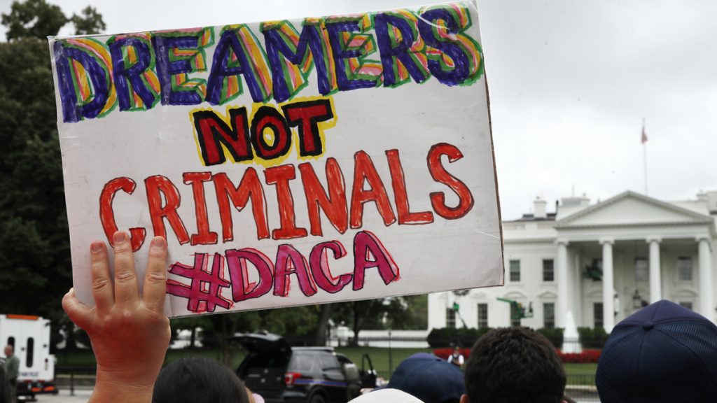 apdacax1200 In this Aug. 15, 2017 a woman holds up a signs in support of the Obama administration program known as Deferred Action for Childhood Arrivals, or DACA, during an immigration reform rally at the White House in Washington. After months of delays, President Donald Trump is expected to decide soon on the fate of so called 'dreamers' who were brought into the country illegally as children as he faces a looming court deadline and is digging in on appeals to his base. (Jacquelyn Martin/AP Photo, File)