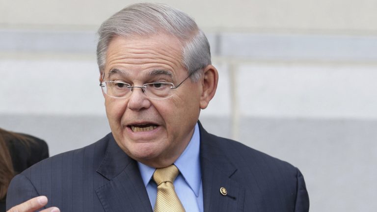 In this file photo, Sen. Bob Menendez talk to reporters as he arrives to court for his federal corruption trial in Newark, N.J., (Seth Wenig/AP Photo)