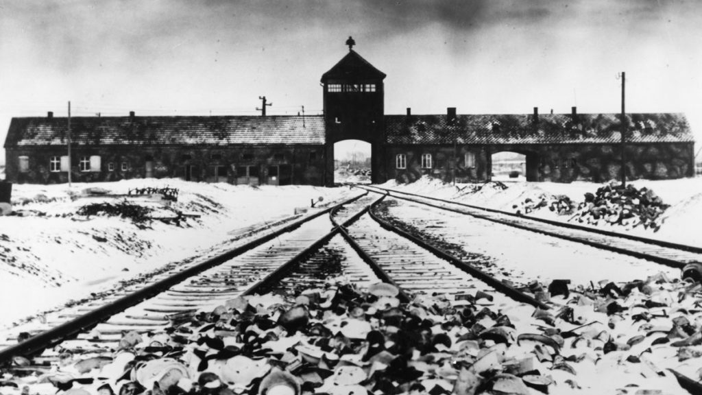  Entry to the concentration camp Auschwitz-Birkenau, Poland, with snow covered railtracks leading to the camp in February/March 1945.  (AP Photo/Stanislaw Mucha) 