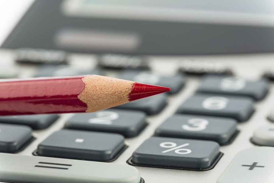 red pen and calculator Red pencil and calculator