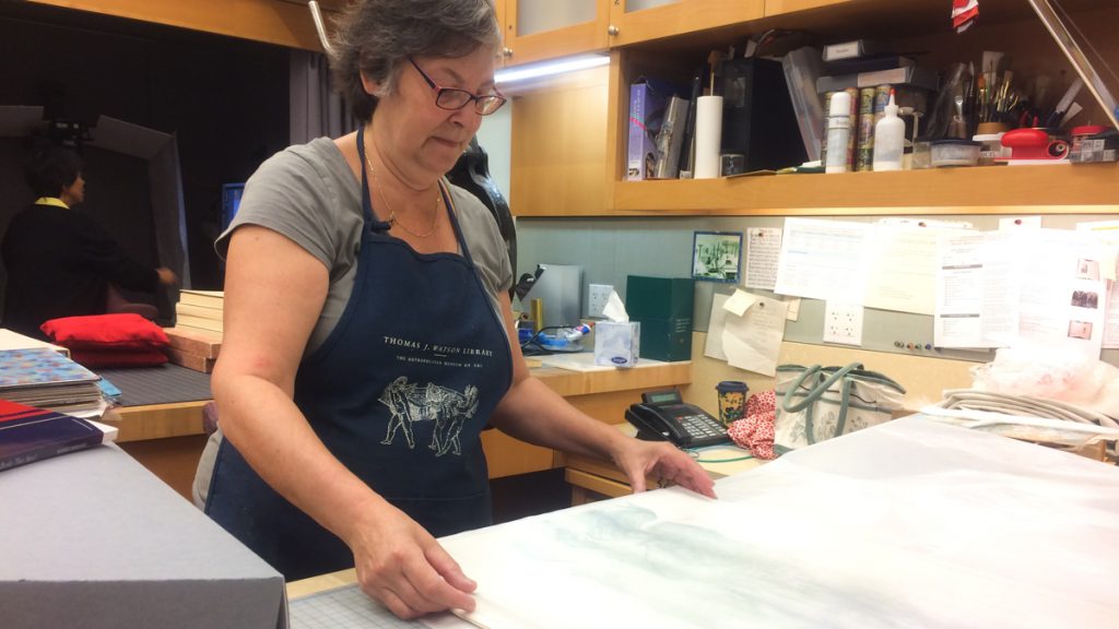 books-4 Mindell Dubansky has been repairing books at the Met for 35 years. (Alan Yu/WHYY)