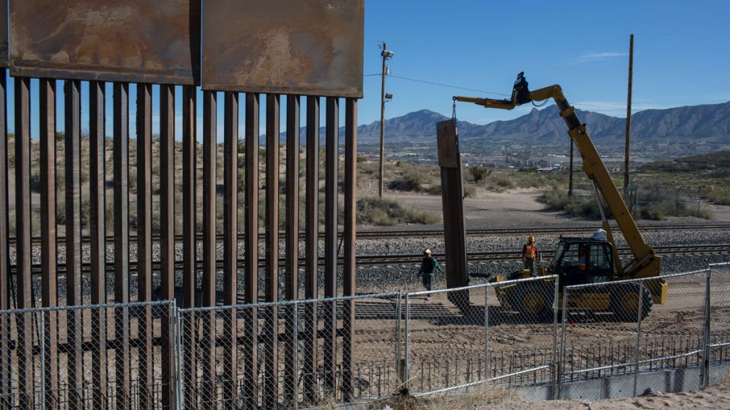 border-walll-1200 In this March 30, 2017 file photo, Workers use a crane to lift a segment of a new fence into place on the U.S. side of the border with Mexico. (AP Photo/Rodrigo Abd)
