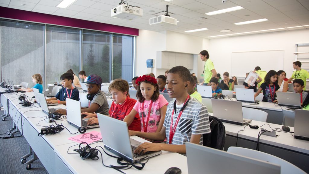 Participants work together to build different creations during the the inaugural Block by Block Party, a Minecraft gaming event and family science festival at USciences benefiting Philadelphia Public Schools. (Emily Cohen for WHYY)