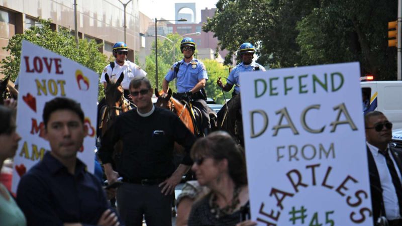 Mounted police follow protesters on Arch Street as they wind their way through Center City.