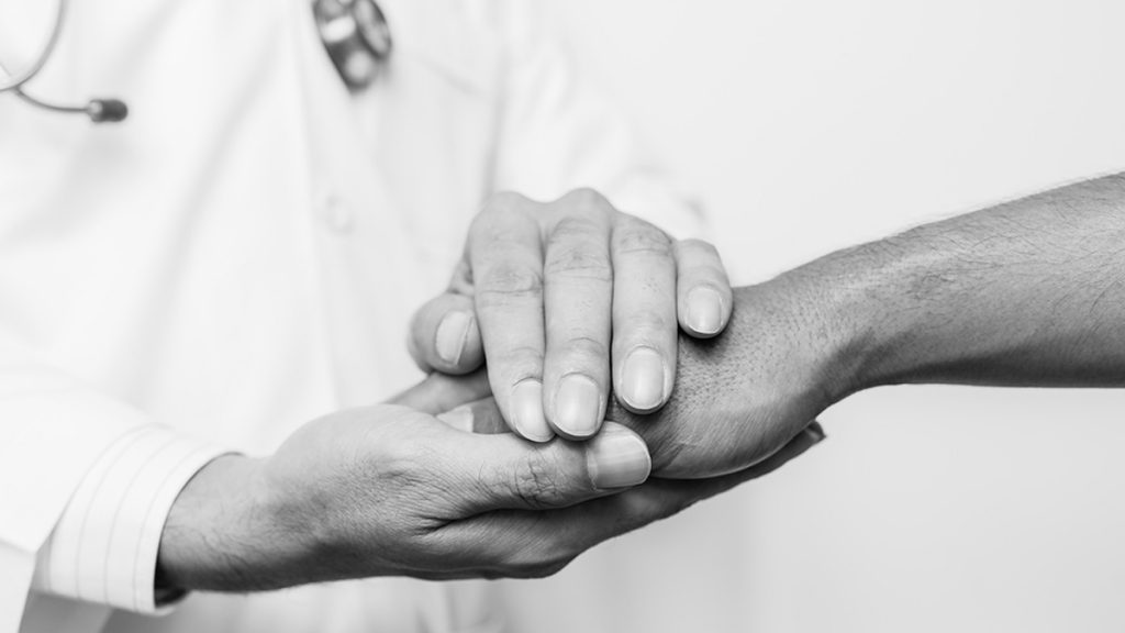 doctor-patient_1200x675 (<a href='https://www.bigstockphoto.com/image-159092963/stock-photo-two-people-holding-hands-for-comfort-black-and-white-doctor-s-hands-holding-patient-s-hand-for-encouragement-and-empathy-doctor-concept-doctor-man-doctor-support-doctor-talk-doctor-trust-doctor-shake-doctor-waiting'>karn684</a>/Big Stock Photo)