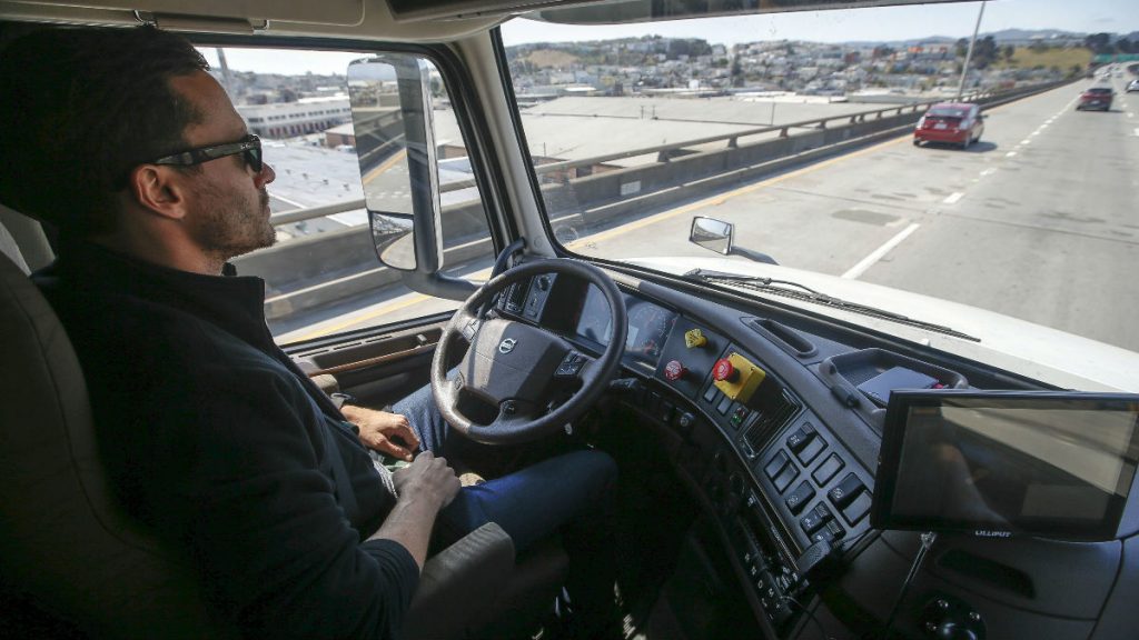 driverless-169 In this Thursday, Aug. 18, 2016, file photo, Matt Grigsby, senior program engineer at Otto, takes his hands off the steering wheel of a self-driving, big-rig truck during a demonstration on the highway, in San Francisco. (AP Photo/Tony Avelar, File)