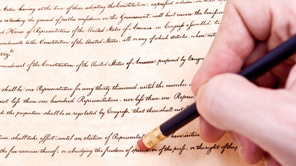 erasing-constitution_1200x675 (<a href='https://www.bigstockphoto.com/image-24731483/stock-photo-closeup-of-hand-pencil-erasing-first-amendment-to-u-s-constitution'>Qingwa</a>/Big Stock Photo)