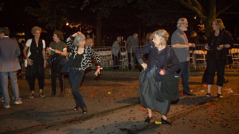 Ladies dance to the music on the Parkway after the debut of ''Cai Guo-Qiang: Fireflies'' on the Ben Franklin Parkway. (Emily Cohen for NewsWorks)