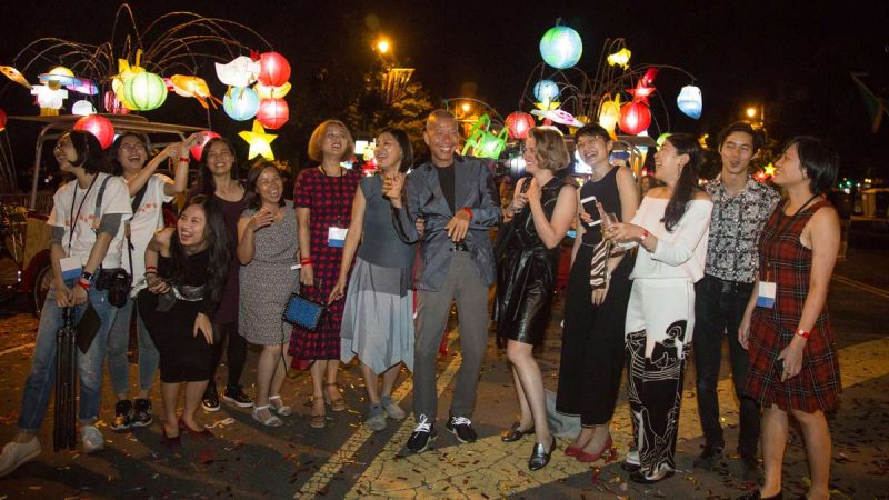 Cai Guo-Qiang (center) celebrates with his New York studio after a successful opening of his public arts project, ''Fireflies,'' in Philadelphia.