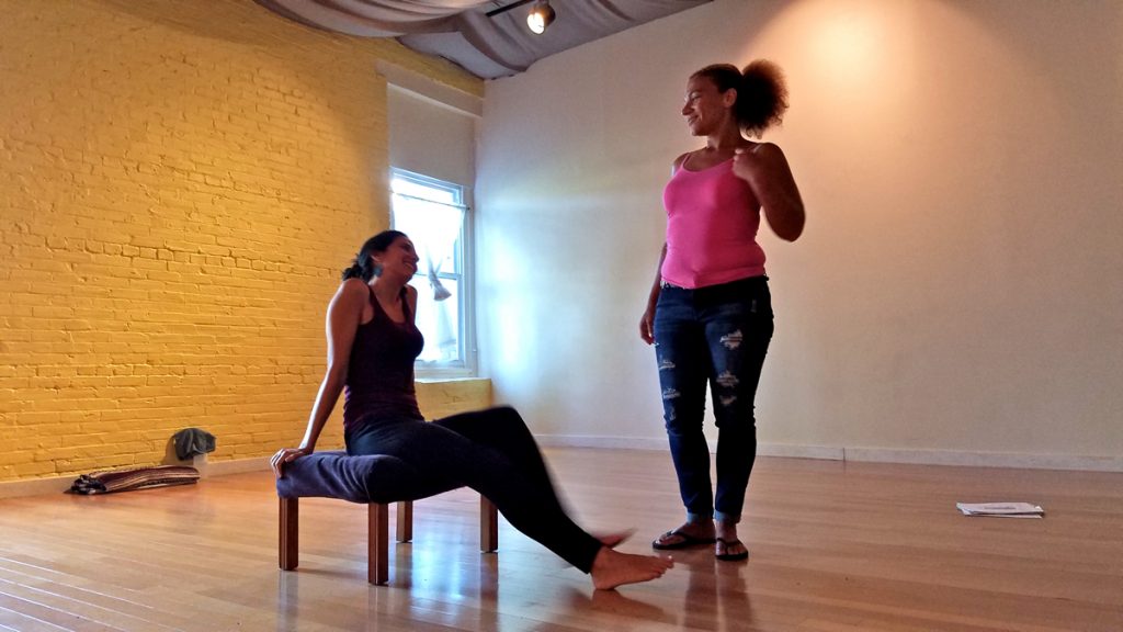 fringe-reentry Bambi Friday (right), who was formerly incarcerated, works on a performance for the Fringe Arts Festival in which she expresses the struggles of re-entry. Seated is Natasha Cohen-Carroll, an associate of Theater of the Oppressed Philadelphia. (Peter Crimmins/WHYY)