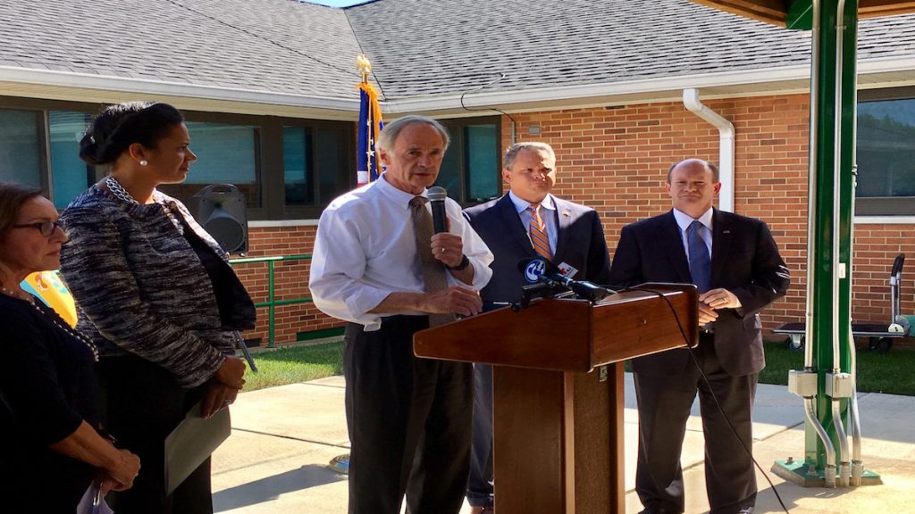 fullsizerender-67 U.S. Sens. Chris Coons and Tom Carper spoke out against the latest GOP health care bill at a press conference outside the VA Medical Center in Wilmington. (Zoë Read/WHYY)