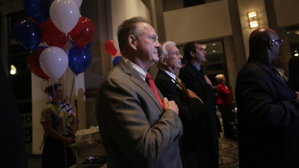l_ap_17270029391901 Former Alabama Chief Justice and U.S. Senate candidate Roy Moore, stops to say the Pledge of Allegiance as he walks around greeting supporters before his election party, Tuesday, Sept. 26, 2017, in Montgomery, Ala. (AP Photo/Brynn Anderson)