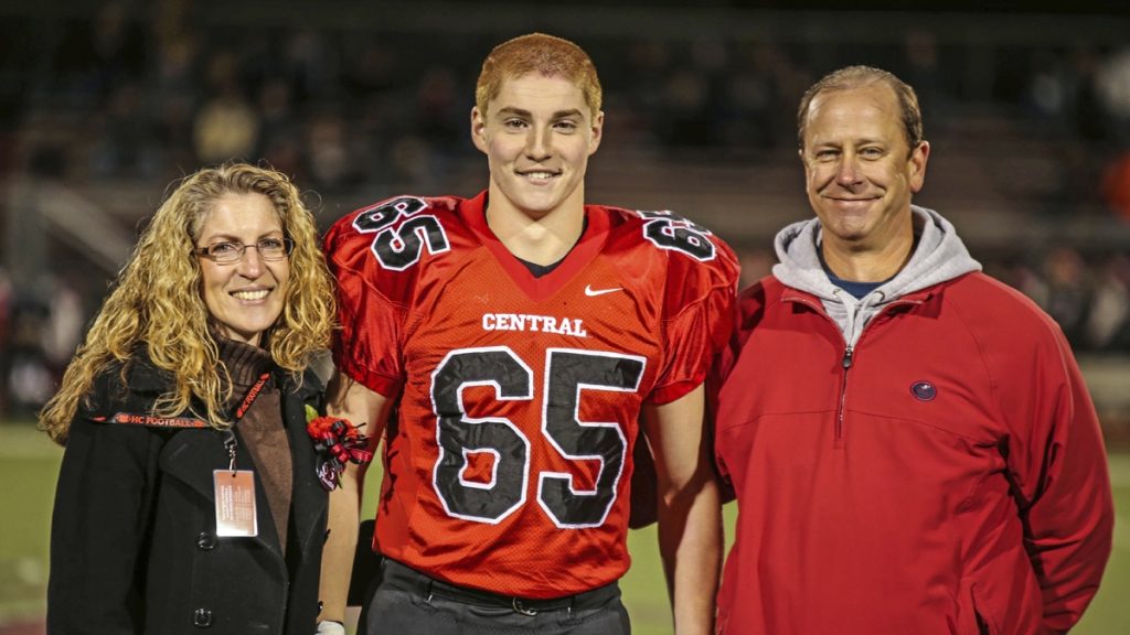l_appiazzapsufratdeathx1200-1-1 This Oct. 31, 2014, photo provided by Patrick Carns shows Timothy Piazza, (center), with his parents Evelyn and James Piazza, during Hunterdon Central Regional High School football's 'Senior Night' at the high school's stadium in Flemington, N.J. (Patrick Carns via AP)