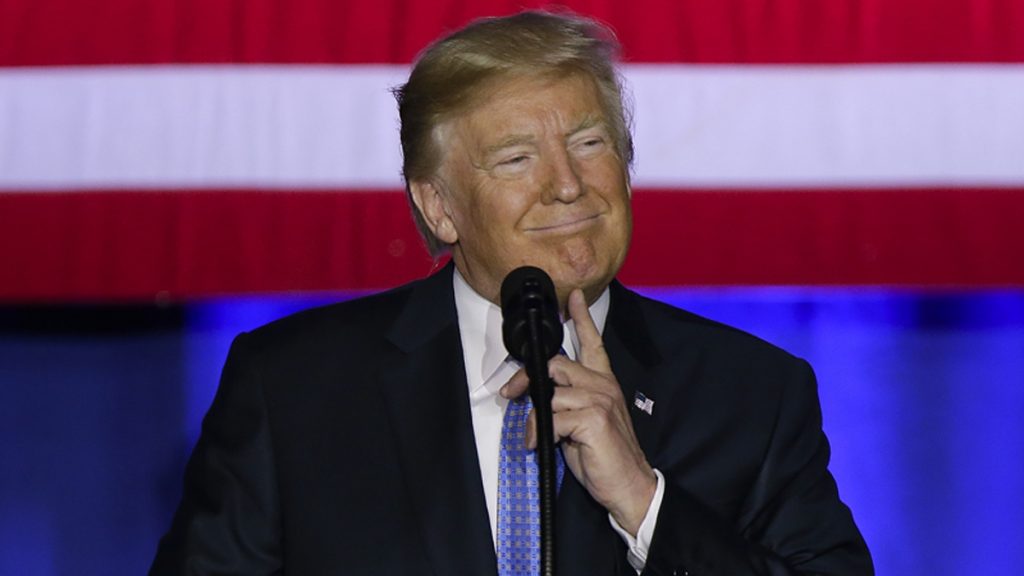 l_aptrumptaxesx1200 Donald Trump at the mic, American flag behind him
