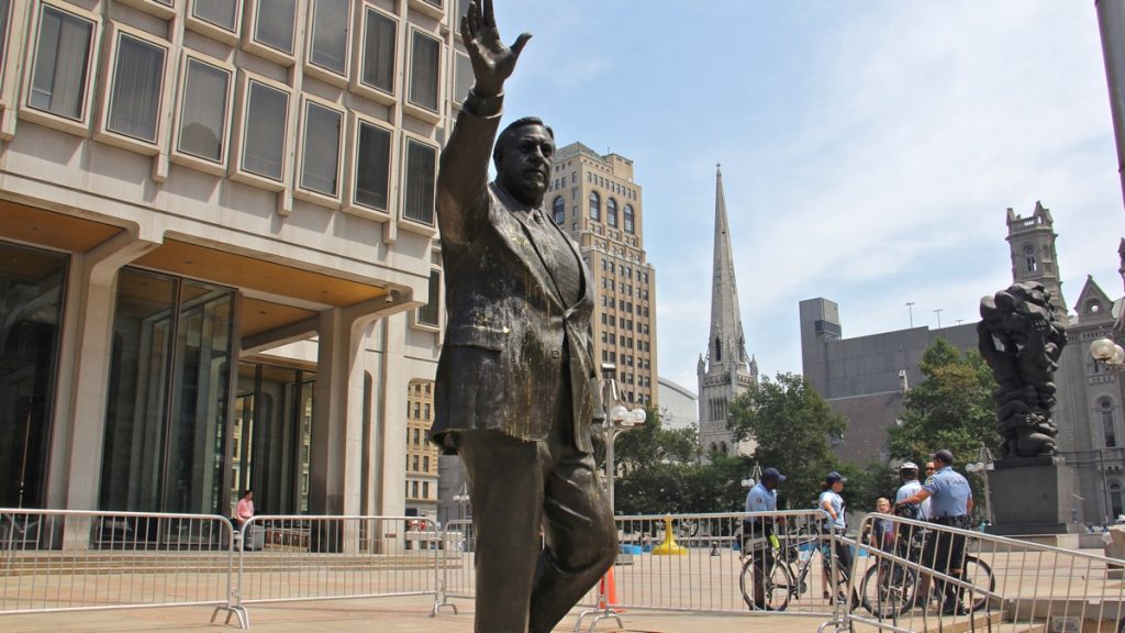 l_rizzo-1 Police stand guard at the Frank Rizzo statue on the grounds of the Municipal Services Building. (Emma Lee/WHYY, file)
