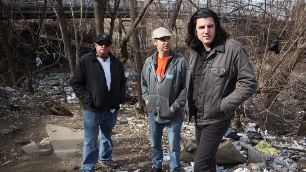 l_safe-injection At right, Dan Martino pictured with activists (from left) Paul Yabor and Paul Cherashore at a heroin camp in Kensington, making the case for safe injection sites in Philly, earlier this year. (Emma Lee/WHYY)