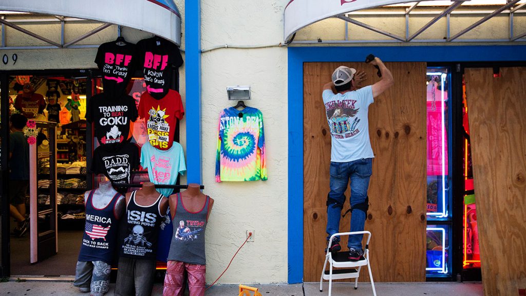 nj-srach-goes-to-floreioa Jone Yoon boards up his beach souvenir shop ahead of Hurricane Irma in Daytona Beach, Fla., Thursday, Sept. 7, 2017. (AP Photo/David Goldman)