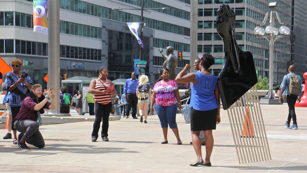 nwelrizzopickx1200 Frank Rizzo's statue on the plaza of the Municipal Services Building stands at the center of controversy. Recently this afro pick with a black power symbol was added.(Emma Lee/WHYY)