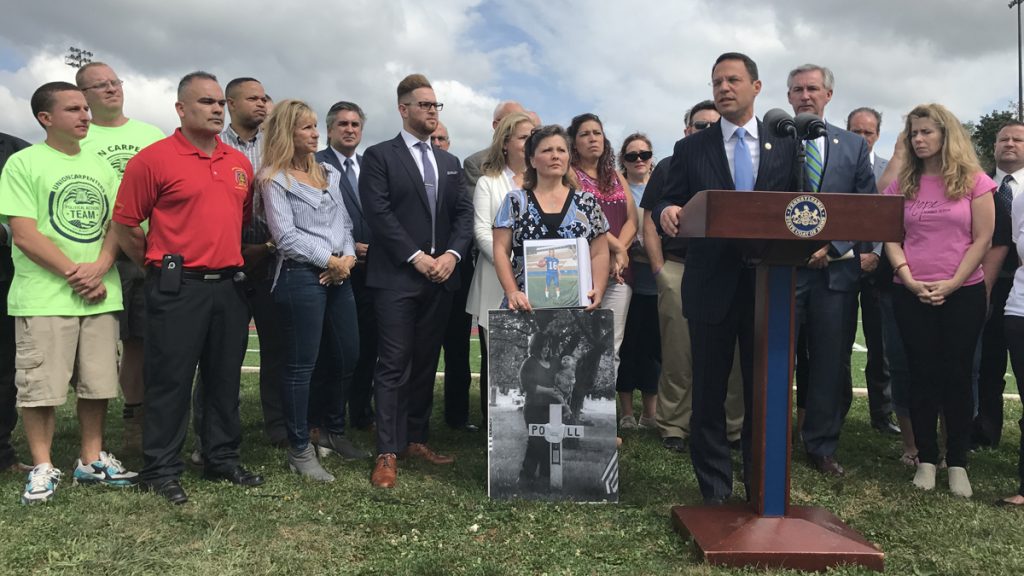 nwlbopioidsuitx1200 Pennsylvania Attorney General Josh Shapiro, flanked by people whose loved ones have been addicted to opioids, announces new details of a 41-state investigation into the role of pharmaceutical companies in the opioid epidemic. (Laura Banshoff/WHYY)