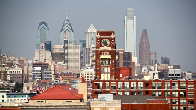  Census data show that poverty in Camden (foreground)is ebbing, while across the river in Philadelphia, the poverty rate remains flat. (Emma Lee/WHYY, file) 
