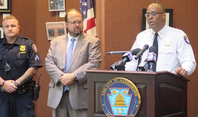 Harrisburg Police Officer Josh Hammer, Mayor Eric Papenfuse and Capt. Deric Moody address reporters during a press conference about the city's body cameras pilot program. (Emily Previti)