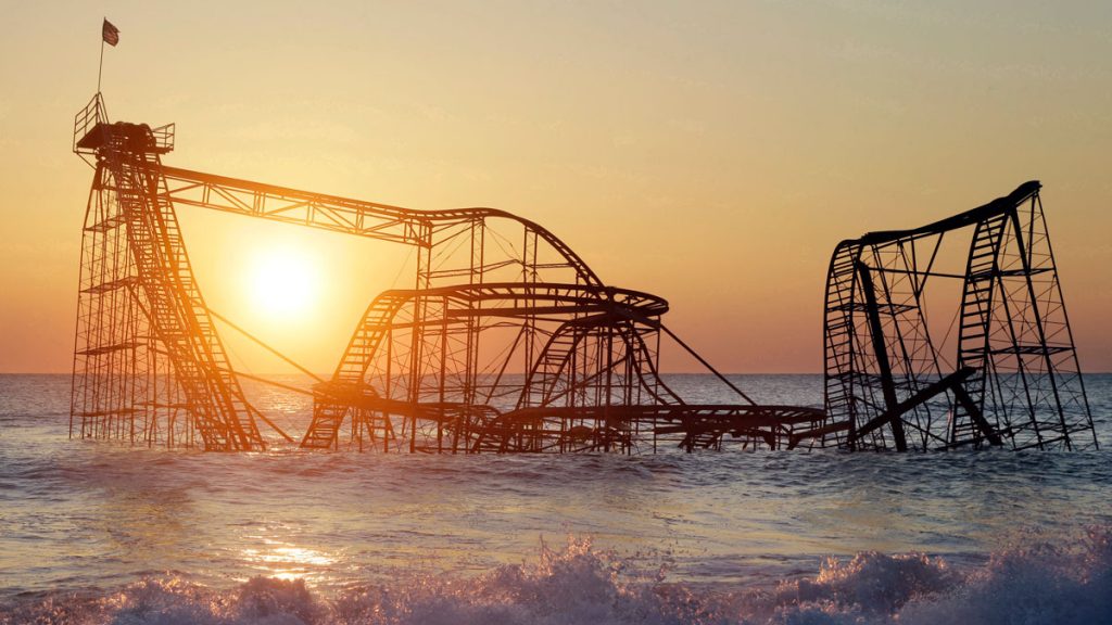 roller-coater-sunset FILE - In this Feb. 25, 2013 photo, the sun rises in Seaside Heights, N.J., behind the Jet Star Roller Coaster which fell into the ocean during Superstorm Sandy. In May 2013 it was dismantled and removed. (AP Photo/Mel Evans, File)
