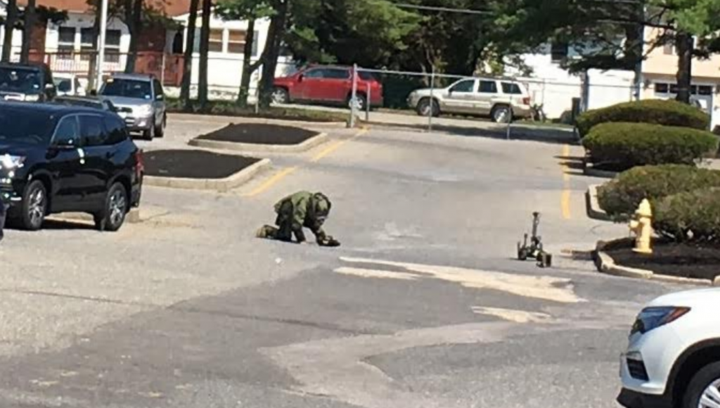 screen-shot-2017-08-31-at-2-55-49-pm A state trooper examining what was discovered to be an imitation explosive device in Toms River Thursday morning. (Photo: Toms River Police Department)
