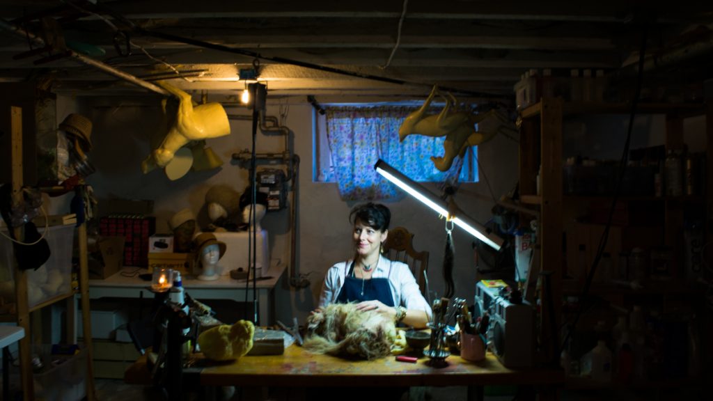 taxidermy Beth Beverly works in her studio where she makes hats, jewelry and home decor items with parts of dead animals. (Paige Pfleger/WHYY)